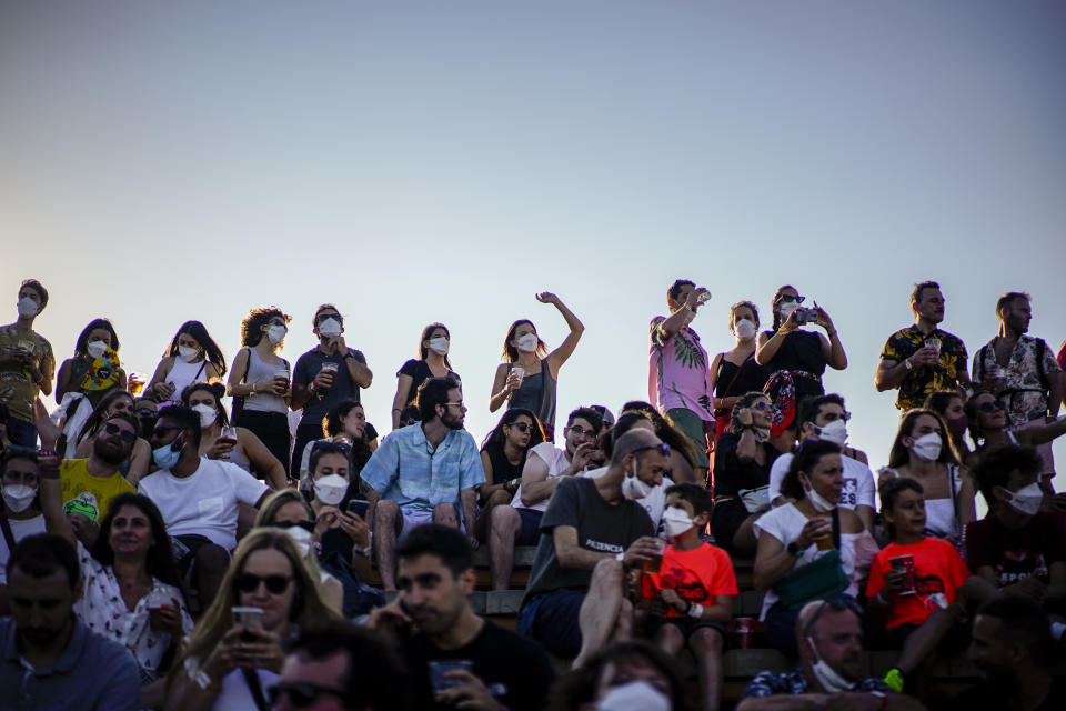 People attend the Cruilla music festival in Barcelona, Spain, Friday, July 9, 2021. (AP Photo/Joan Mateu)