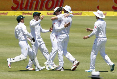 South Africa celebrate the wicket of England's Alistair Cook (not in picture) during the second cricket test match in Cape Town, South Africa, January 2, 2016. REUTERS/Mike Hutchings