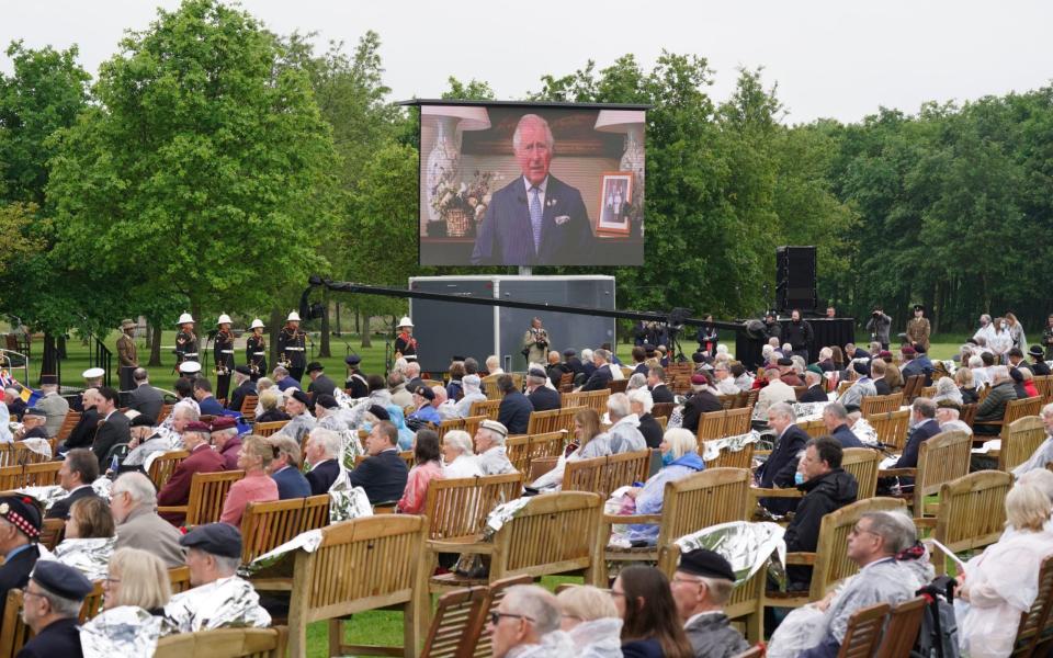 Veterans watch Prince Charles's address at the ceremony at the National Memorial Arboretum, followed by a live feed from the official opening of the British Normandy Memorial in Normandy -  Jacob King/PA