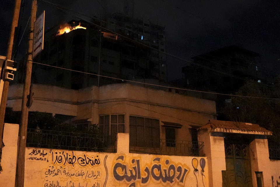 A fire burns in an apartment of an Islamic Jihad commander for northern Gaza, following an Israeli airstrike, in Gaza City, early Tuesday, May 9, 2023. Israeli aircraft conducted strikes early Tuesday on Islamic Jihad targets in the Gaza Strip, the Israeli military said. The Palestinian Health Ministry said a number of people were killed and injured in the airstrikes. (AP Photo/Adel Hana)