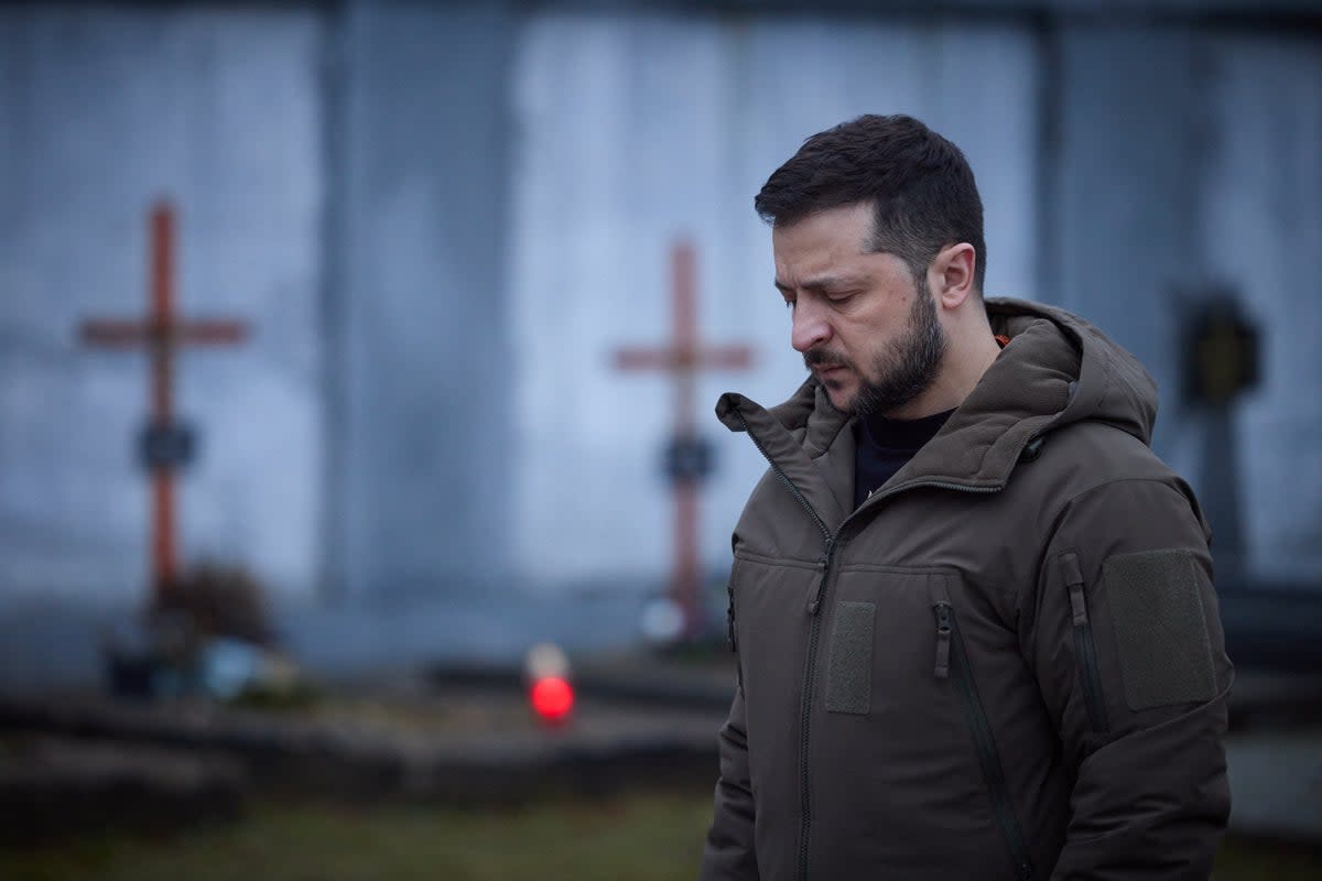 Volodymyr Zelensky paying tribute to fallen soldiers at the Field of Mars of Lychakiv Cemetery in the western city of Lviv, last month (Ukranian Presidential Press/AFP/Getty)