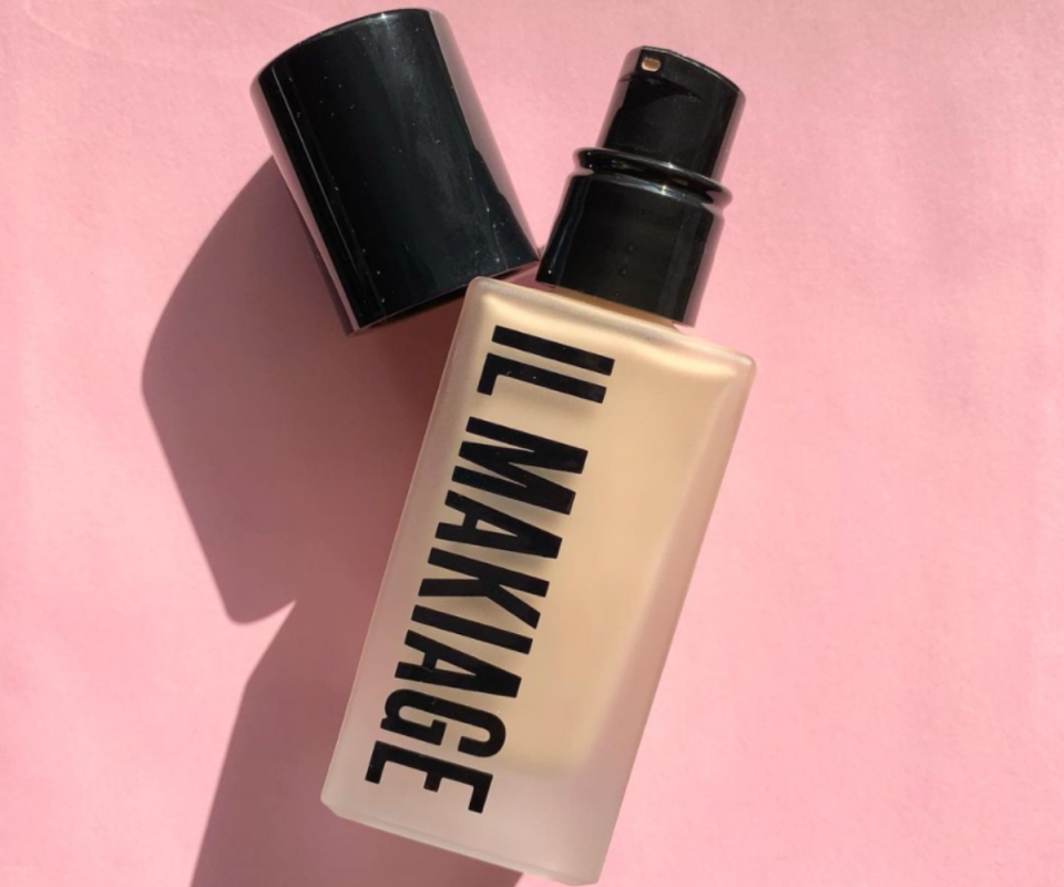 A bottle of Il Makiage foundation on a pink background