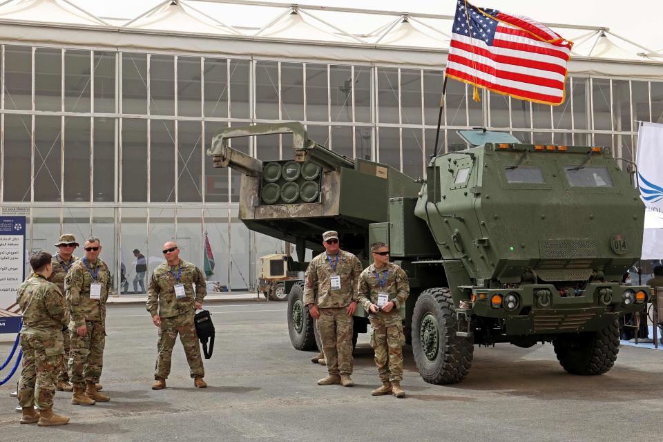 US military personnel stand by a M142 High Mobility Artillery Rocket System (HIMARS) during Saudi Arabias first World Defense Show, north of the capital Riyadh,  on March 6, 2022.