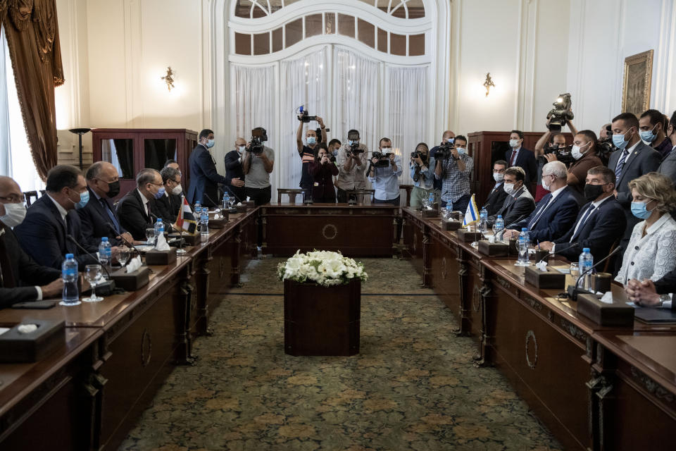 Egyptian Foreign Minister Sameh Shoukry, third from left, meets with Israeli Foreign Minister Gabi Ashkenazi, second from right, at the Tahrir Palace in Cairo, Egypt, Sunday, May 30, 2021. (AP Photo/Nariman El-Mofty)