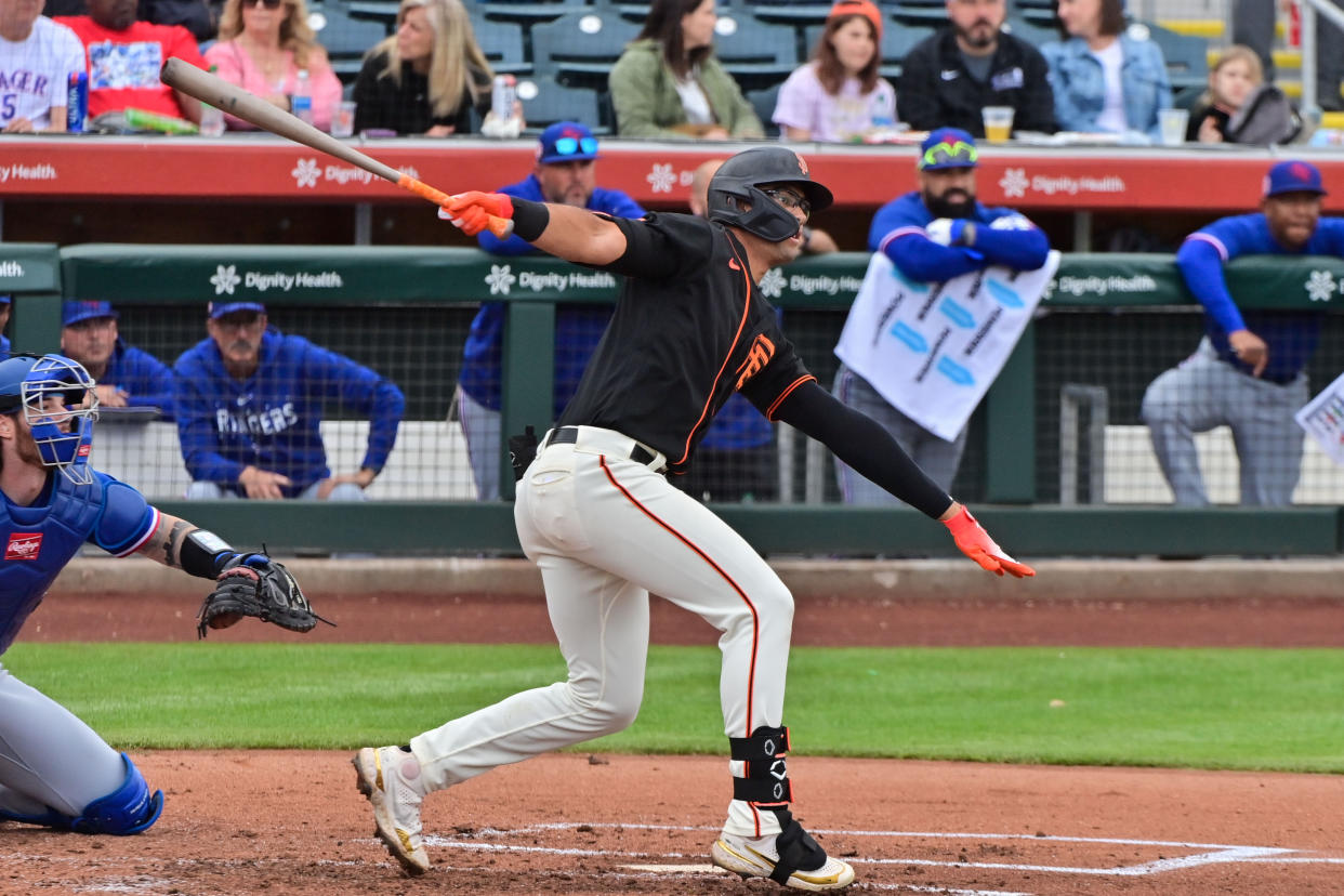 Mar 22, 2023; Scottsdale, Arizona, USA; San Francisco Giants catcher Blake Sabol (2) flies out in the second inning against the Texas Rangers during a Spring Training game at Scottsdale Stadium. Mandatory Credit: Matt Kartozian-USA TODAY Sports