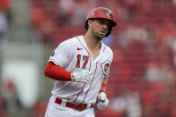 Cincinnati Reds' Kyle Farmer runs the bases after hitting a solo home run during the fourth inning of the team's baseball game against the Colorado Rockies in Cincinnati, Friday, June 11, 2021. (AP Photo/Aaron Doster)