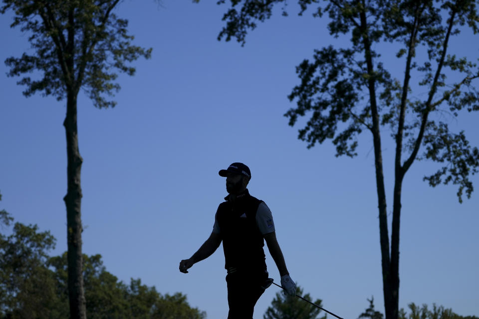 Dustin Johnson, of the United States, walks along the third fairway during the third round of the US Open Golf Championship, Saturday, Sept. 19, 2020, in Mamaroneck, N.Y. (AP Photo/John Minchillo)