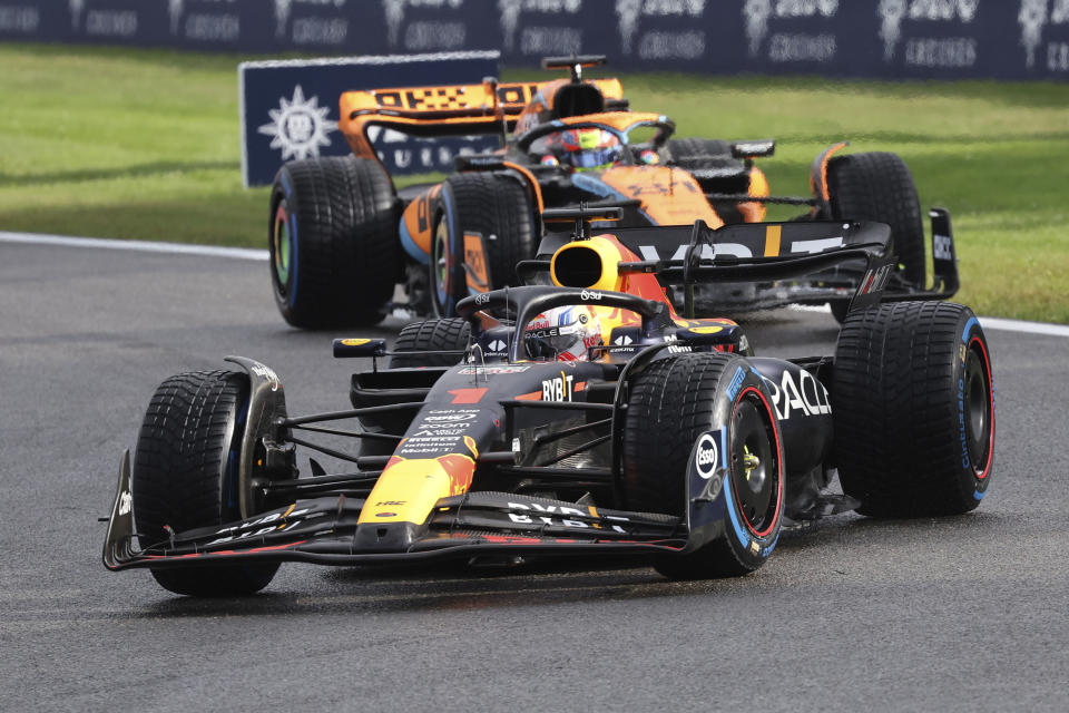 Red Bull driver Max Verstappen of the Netherlands, right, and McLaren driver Oscar Piastri of Australia steer their cars during the sprint race ahead of the Formula One Grand Prix at the Spa-Francorchamps racetrack in Spa, Belgium, Saturday, July 29, 2023. The Belgian Formula One Grand Prix will take place on Sunday. (AP Photo/Geert Vanden Wijngaert)