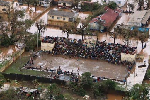Stranded: Survivors of Cyclone Idai gather at the basketball stadium in Buzi, central Mozambique -- a relative haven from the flood water