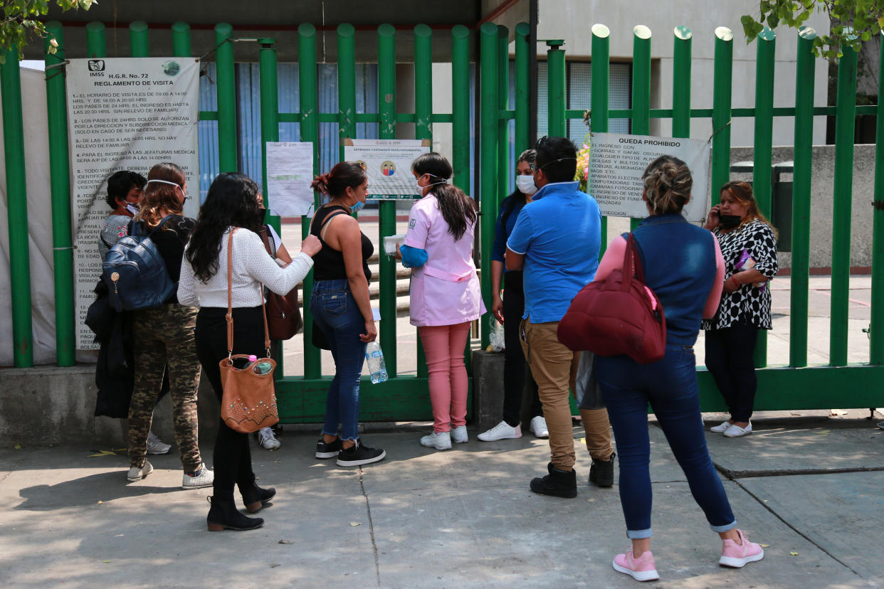 TLALNEPANTLA, MEXICO - APRIL 9: People wait for their relatives outside IMSS 'Vicente Santos Guajardo' hospital where at least 19 doctors have tested positive for the coronavirus on April 9, 2020 in Tlalnepantla, Mexico. The Coronavirus (COVID-19) pandemic has spread to many countries across the world, claiming over 95,000 lives and infecting over 1.5 million. Mexico has confirmed over 3,000 cases and 194 deaths.   (Photo by Oswaldo Amaya/Jam Media/Getty Images)