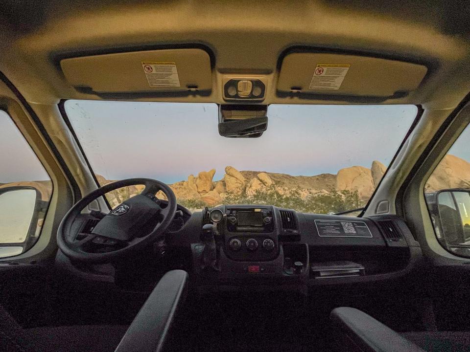 A sunset through the van's front window.