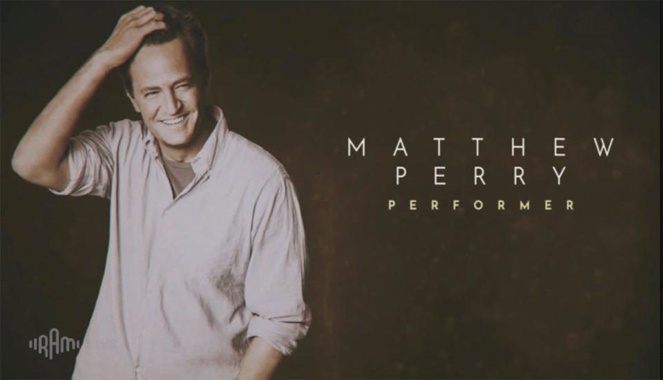 Matthew Perry with his arm on his head
