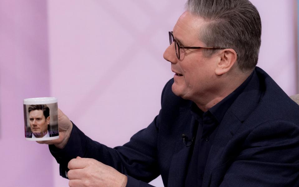 Sir Keir Starmer, the Labour leader, receives a mug during an interview on ITV's Lorraine programme