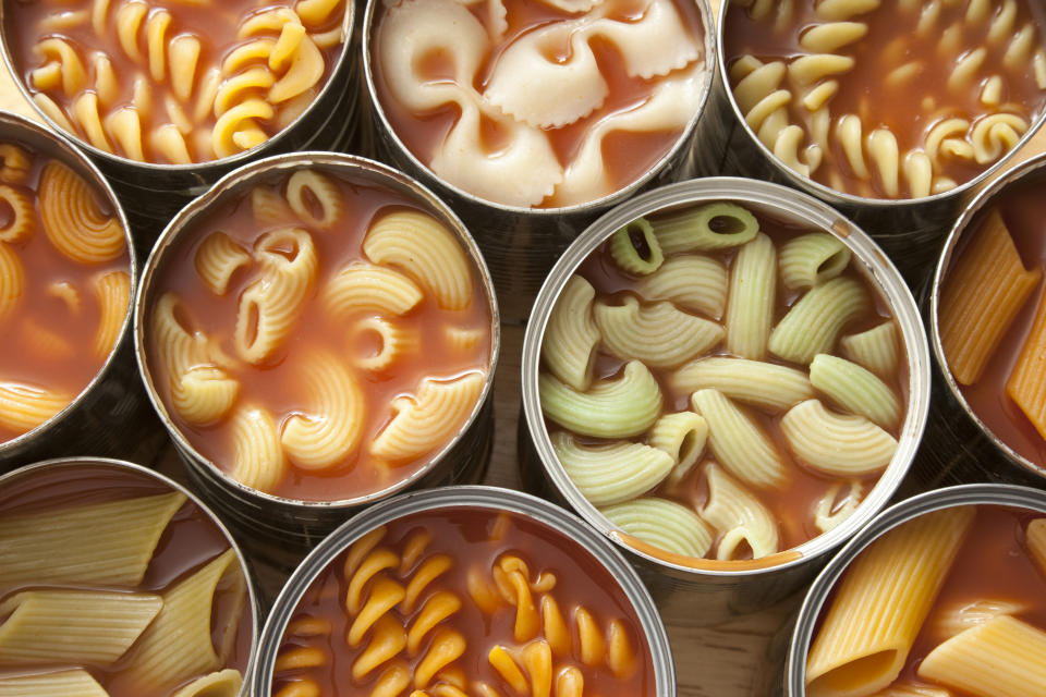 High angle view of lots of cans with variety of pastas in them