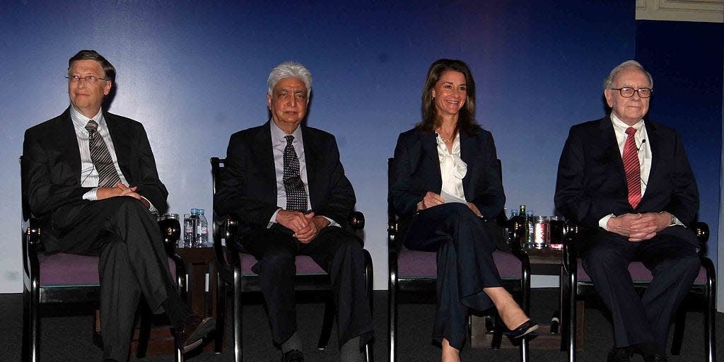 Bill Gates, Azim Premji , Melinda Gates and Warren Buffet during a press conference in New Delhi, Thursday, March 24, 2011.