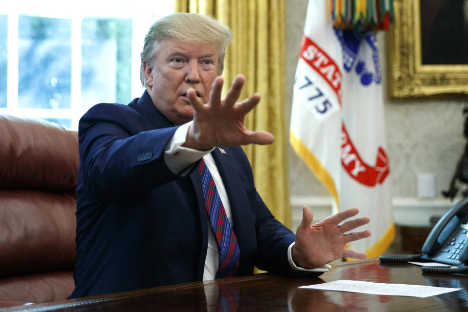 President Donald Trump speaks in the Oval Office of the White House in Washington, Friday, July 26, 2019. Trump announced that Guatemala is signing an agreement to restrict asylum applications to the U.S. from Central America.(AP Photo/Carolyn Kaster)