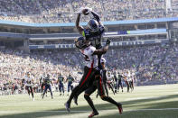 Seattle Seahawks wide receiver DK Metcalf, above, makes a catch in the end zone for a touchdown as Atlanta Falcons safety Jaylinn Hawkins defends during the first half of an NFL football game Sunday, Sept. 25, 2022, in Seattle. (AP Photo/John Froschauer)