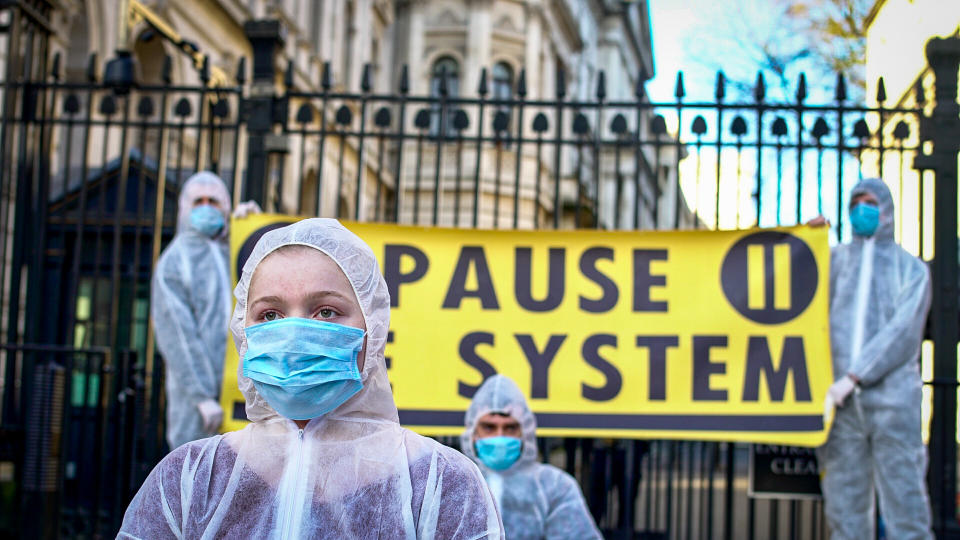 Peaceful protestors wore masks as they urged the PM to act on coronavirus                               