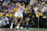 Xavier forward Jerome Hunter drives to the basket past Pittsburgh forward Blake Hinson during the first half of a second-round college basketball game in the NCAA Tournament on Sunday, March 19, 2023, in Greensboro, N.C. (AP Photo/Chris Carlson)