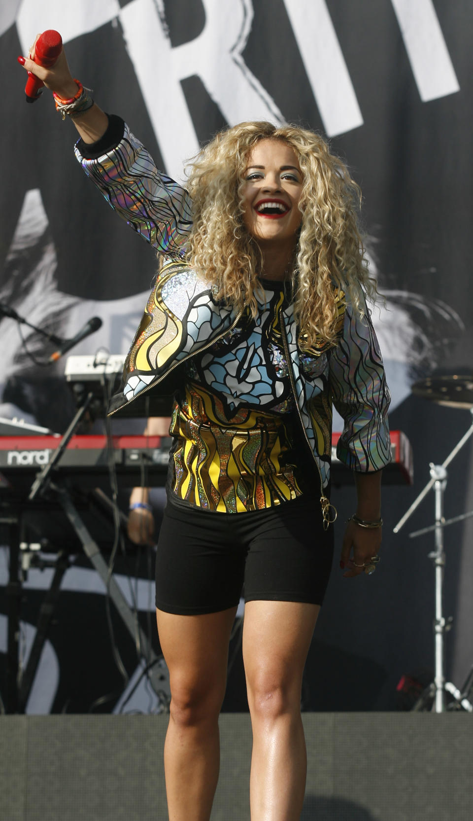 Rita Ora looked stylish in black shorts and metallic patterned jacket at Wireless [Jim Ross/Invision/AP]