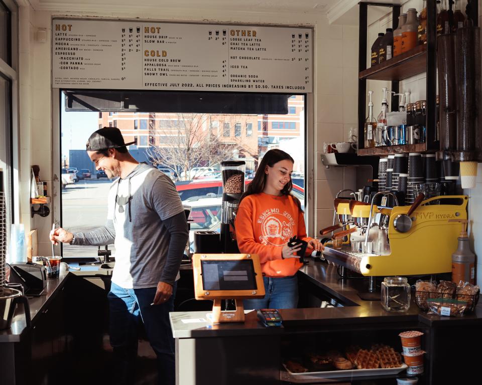 (left to right) Baristas Matt Clark and Kamryn Deutsch service customers at Outpost Coffee in the heart of downtown Bartlesville.