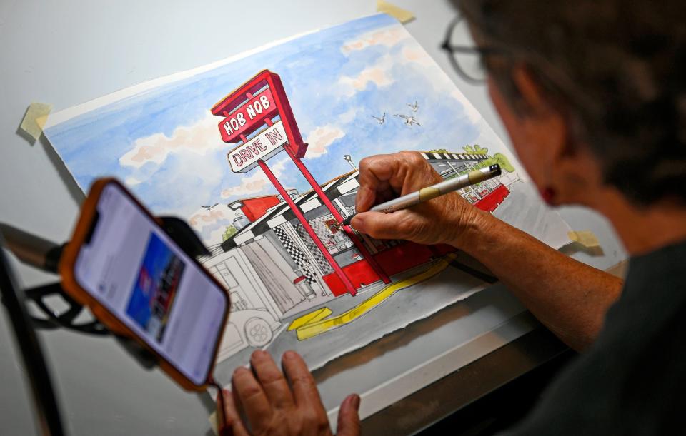 Enid Romanek, 85, works on one of Sarasota's famous landmarks, the Hob Nob Drive In Restaurant.