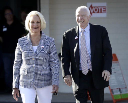 U.S. Sen. John McCain, R-Ariz., and his wife, Cindy McCain, leave a polling station after voting, Tuesday, Aug. 30, 2016, in Phoenix. McCain is seeking the Republican nomination in Arizona's primary election. (AP Photo/Matt York)