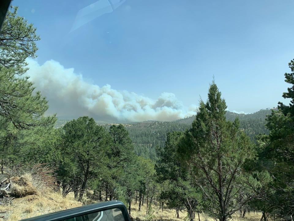 An Alto resident captures an image of wildfires burning in the Lincoln National Forest started April 12, 2022.