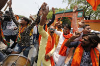 Bharatiya Janata Party (BJP) workers celebrate at BJP headquarters in, Lucknow, India, Thursday, May 23, 2019. Indian Prime Minister Narendra Modi and his party were off to an early lead as vote counting began Thursday following the conclusion of the country's 6-week-long general election, sending the stock market soaring in anticipation of another five-year term for the Hindu nationalist leader.(AP Photo/Rajesh Kumar Singh)