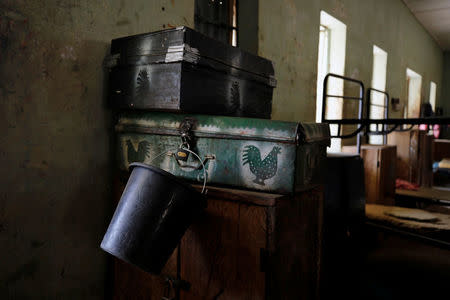 A bucket is pictured amidst belongings inside girls hostel at the school in Dapchi in the northeastern state of Yobe, where dozens of school girls went missing after an attack on the village by Boko Haram, Nigeria February 23, 2018. REUTERS/Afolabi Sotunde
