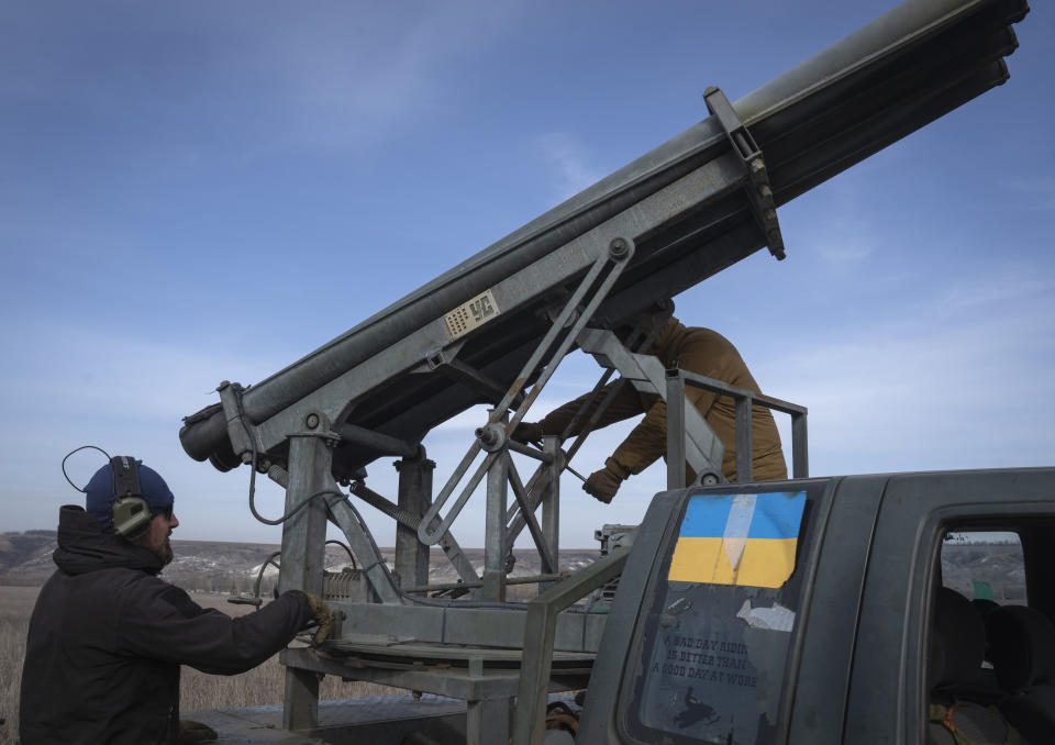 Ukrainian soldiers from The 56th Separate Motorized Infantry Mariupol Brigade prepare to fire a multiple launch rocket system based on a pickup truck towards Russian positions at the front line, near Bakhmut, Donetsk region, Ukraine, Tuesday, March 5, 2024. (AP Photo/Efrem Lukatsky)