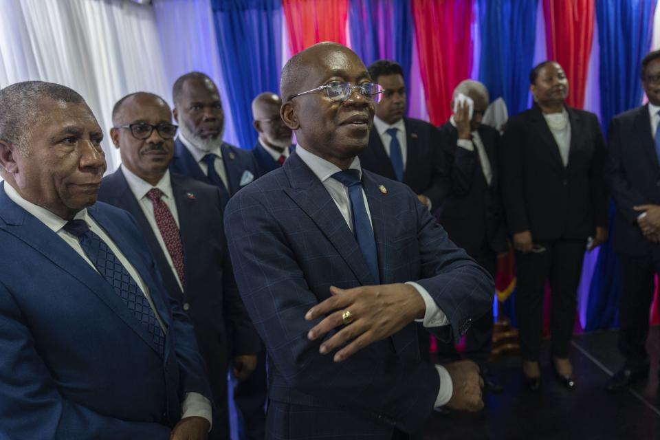 Michel Patrick Boisvert, center, who was named interim Prime Minister by the remaining cabinet of outgoing Prime Minister Ariel Henry, attends the swearing-in ceremony of the transitional council tasked with selecting Haiti's new prime minister and cabinet, in Port-au-Prince, Haiti, Thursday, April 25, 2024. Boisvert was previously the economy and finance minister. (AP Photo/Ramon Espinosa)