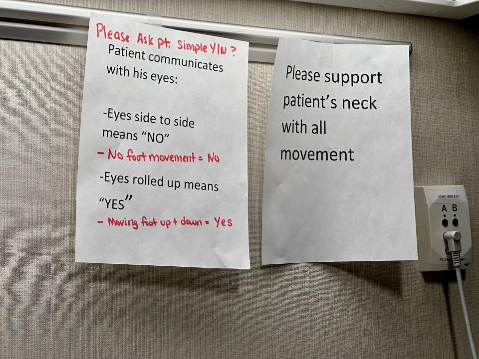 Messages hang on a wall next to Tariq Massenburg's bed at Whittier Rehabilitation Hospital.