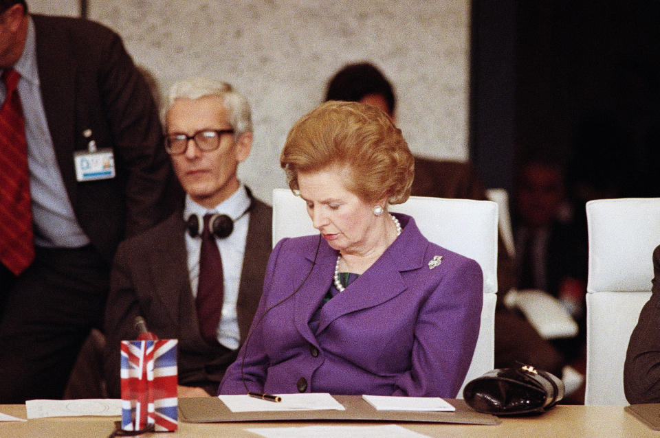 FILE - In this Thursday, Nov. 20, 1990 file photo, British Prime Minister Margaret Thatcher dozes off for a few minutes while attending the Conference on Security and Cooperation in Europe. A few days later, Thatcher resigned after 11 years as prime minister, largely because of her strident views on future European integration. On Friday, May 24, 2019 announced she would resign as party leader, effective June 7, because of her inability to deliver on a referendum to leave the European Union. May has joined the ranks of Conservative prime ministers whose time in office has been overwhelmed — and cut short — by the issue of Europe. (AP Photo/Lionel Cironneau, File)
