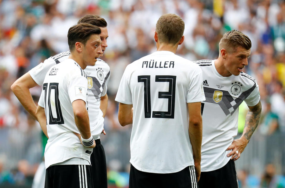 Germany's Mesut Ozil, Julian Draxler, Thomas Muller and Toni Kroos look dejected after Mexico's Hirving Lozano (not pictured) scored their first goal.