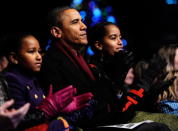 U.S. President Barack Obama and daughters Sasha (L) and Malia participate in the 2011 National Christmas Tree Lighting on December 1, 2011 at the Ellipse, south of the White House, in Washington, DC. The first family participated in the 89th annual National Christmas Tree Lighting Ceremony. (Photo by Roger L. Wollenberg-Pool/Getty Images)