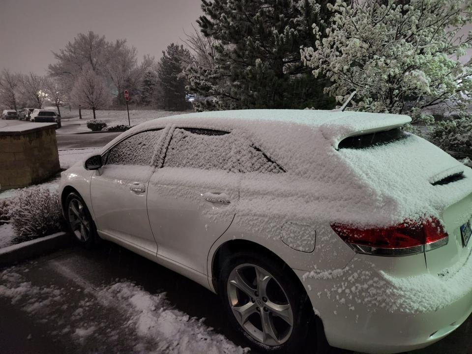 A photo of Eric and Beth Ann Mott's car covered in snow in Colorado