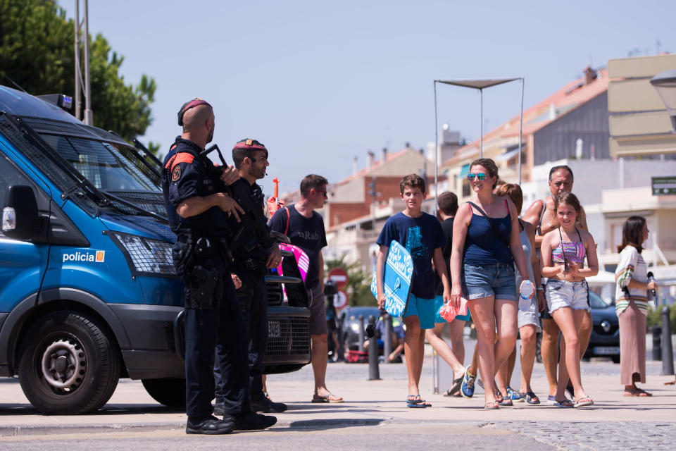 <p>Police officers patrol on the spot where five terrorists were shot by police on August 18, 2017 in Cambrils, Spain. (Photo: Alex Caparros/Getty Images) </p>