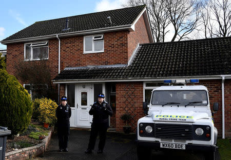FILE PHOTO: Police officers stand guard outside of the home of former Russian military intelligence officer Sergei Skripal, in Salisbury, Britain, March 6, 2018. Picture taken March 6, 2018. REUTERS/Toby Melville/File Photo