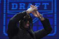 Ohio State wide receiver Marvin Harrison Jr. walks on stage before the first round of the NFL football draft, Thursday, April 25, 2024, in Detroit. (AP Photo/Jeff Roberson)