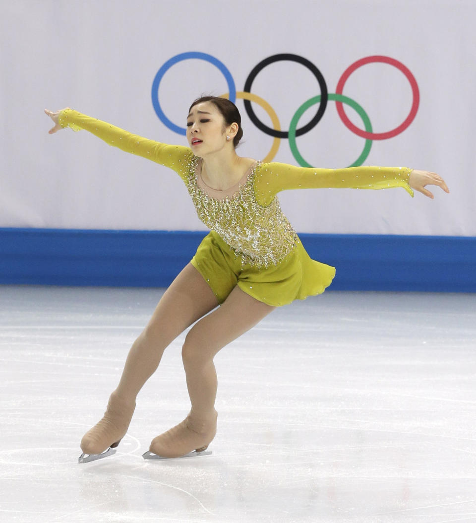 Yuna Kim of South Korea competes in the women's short program figure skating competition at the Iceberg Skating Palace during the 2014 Winter Olympics, Wednesday, Feb. 19, 2014, in Sochi, Russia. (AP Photo/Darron Cummings)