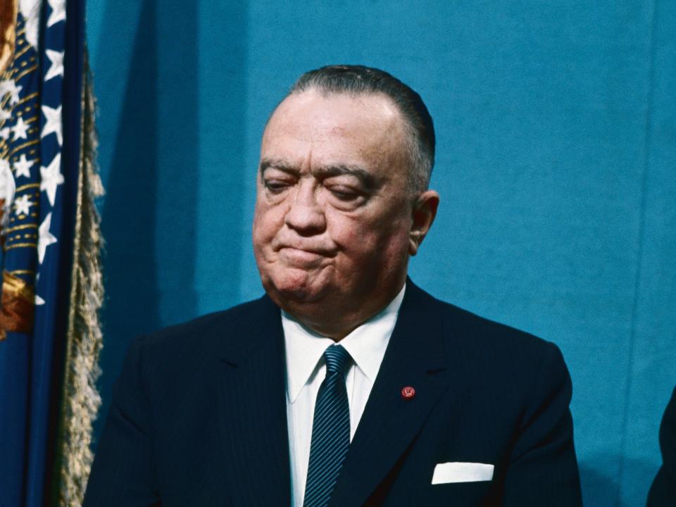 J. Edgar Hoover listens to President Lyndon B. Johnson's speech.