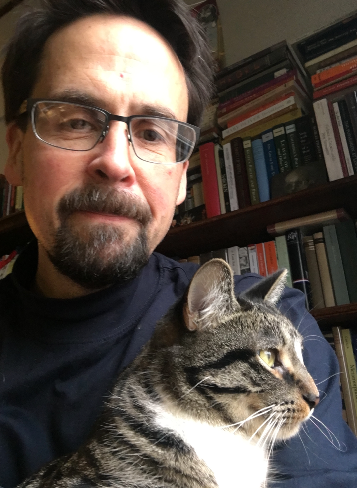 Jon M. Sweeney, author of "Sit in the Sun: And Other Lessons in the Spiritual Wisdom of Cats," sits with his cat Martin.