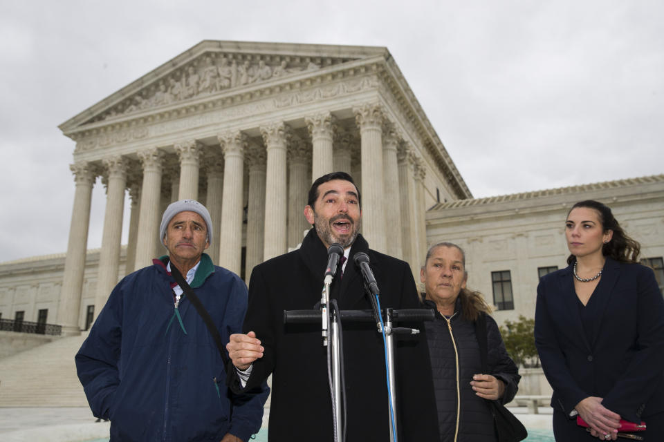 Attorney Cristobal Galindo, second from left, speaks accompanied by Jesus Hernandez, left, and Maria Guereca, and attorney Marion Reilly after oral arguments in front of the Supreme Court, Tuesday, Nov. 12, 2019 in Washington. The case involves U.S. border patrol agent Jesus Mesa, Jr., who fired at least two shots across the Mexican border, killing Sergio Adrian Hernandez Guereca, 15, who'd been playing in the concrete culvert between El Paso and Cuidad Juarez. (AP Photo/Alex Brandon)