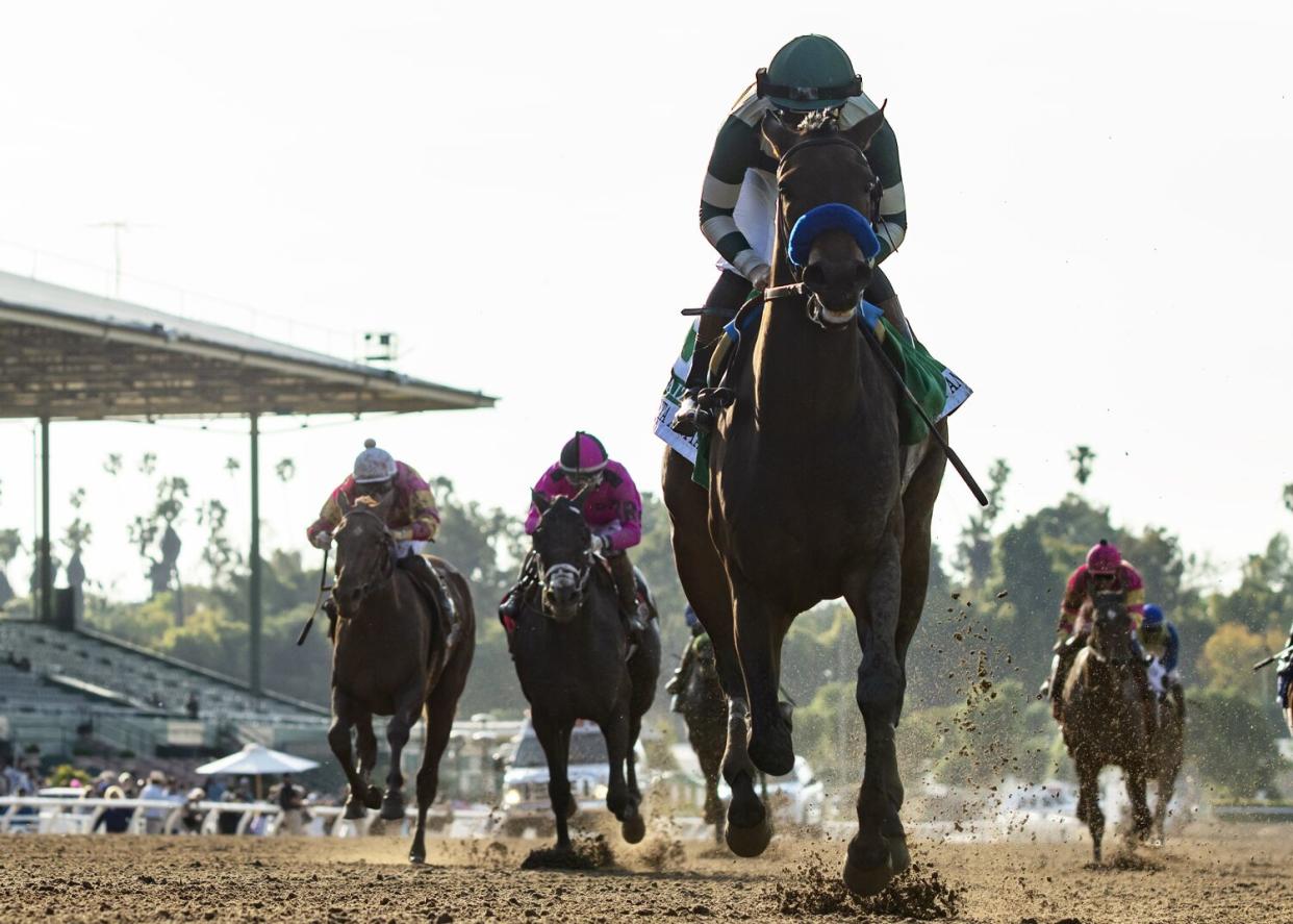 Faiza and jockey Flavien Prat pull away from the field to win the $400,000 Santa Anita Oaks on Saturday.