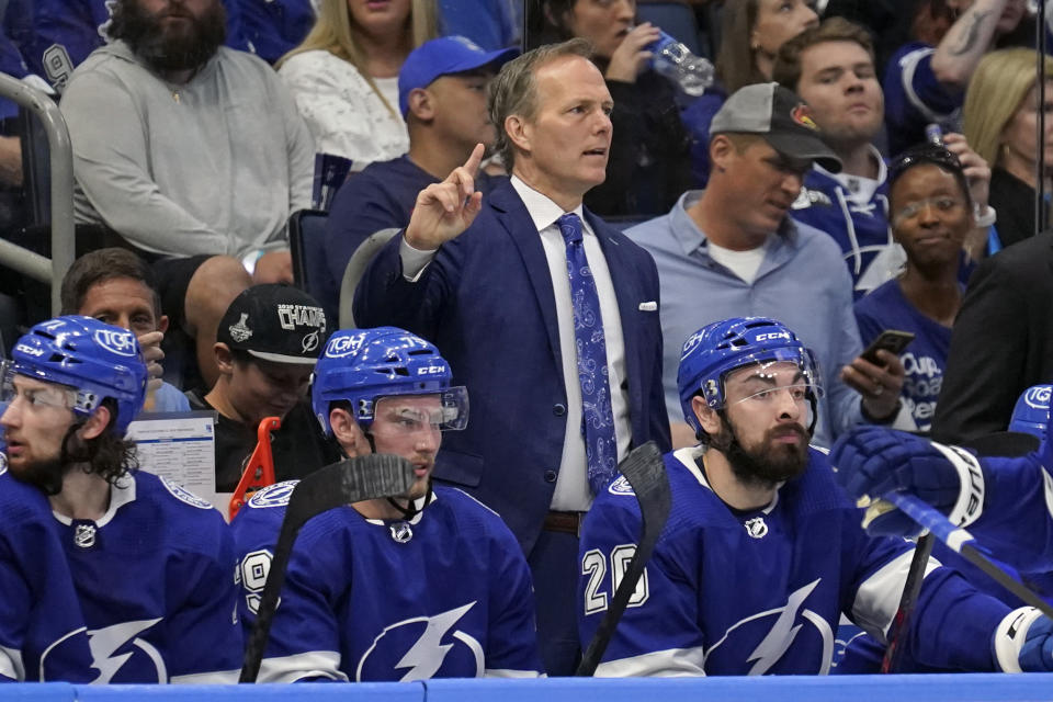 Tampa Bay Lightning head coach Jon Cooper directs players on the ice during the second period in Game 4 of the NHL Hockey Stanley Cup playoffs Eastern Conference finals against the New York Rangers, Tuesday, June 7, 2022, in Tampa, Fla. (AP Photo/Chris O'Meara)