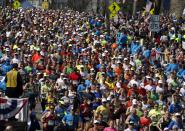 Runners compete near the start of the 118th Boston Marathon Monday, April 21, 2014 in Hopkinton, Mass. (AP Photo/Michael Dwyer)