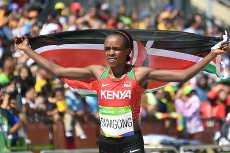 2016 Rio Olympics - Athletics - Final - Women's Marathon -Sambodromo - Rio de Janeiro, Brazil - 14/08/2016. Jemima Sumgong (KEN) of Kenya celebrates after winning the race REUTERS/Johannes Eisele/Pool