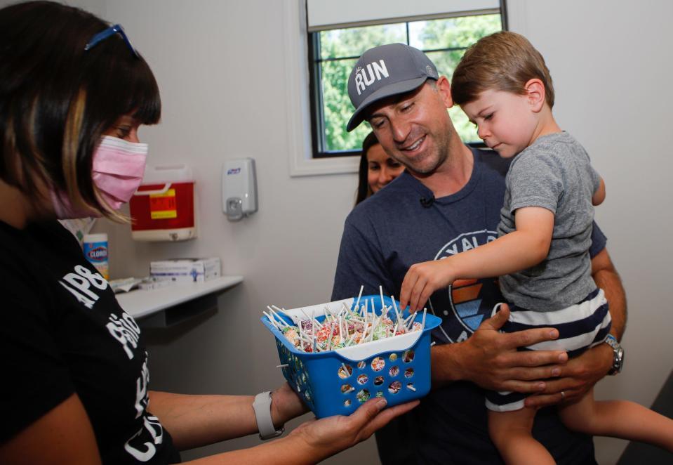 Bryce Phelps, 3, picking a lollipop after receiving his first Pfizer vaccine at Bloom Pediatrics in Birmingham, Michigan, on June 22. Vaccines from Pfizer and Moderna are now available to children as young as 6 months.