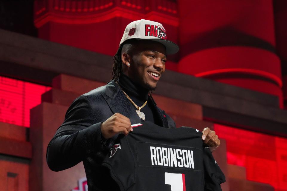 Apr 27, 2023; Kansas City, MO, USA;  Texas running back Bijan Robinson on stage after being selected by the Atlanta Falcons eighth overall in the first round of the 2023 NFL Draft at Union Station.